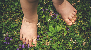 Child's feet in grass
